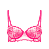 Flat lay of Intrigue Half Cup Bra Disco Pink by Simone Perele, highlighting unlined cups and scalloped edges, available at The Foundation.