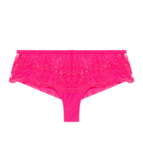 Flat lay of Intrigue Shorty Brief Disco Pink by Simone Perele, displaying velvet scalloped edges and bold pink hue from The Foundation.