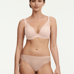 Model wearing Chantelle Norah Chic Plunge T-Shirt Bra Dusky Pink set showing matching bra and briefs in soft recycled fabric.