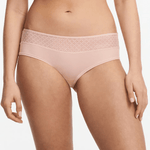 Front view of Chantelle Norah Chic Covering Shorty Brief Dusky Pink on model featuring soft eco-friendly fabric and graphic lace.