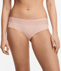 Front view of Chantelle Norah Chic Covering Shorty Brief Dusky Pink on model featuring soft eco-friendly fabric and graphic lace.