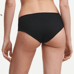 Back view of Chantelle Norah Chic Covering Shorty Brief Black on model highlighting seamless design and soft, eco-friendly fabric.
