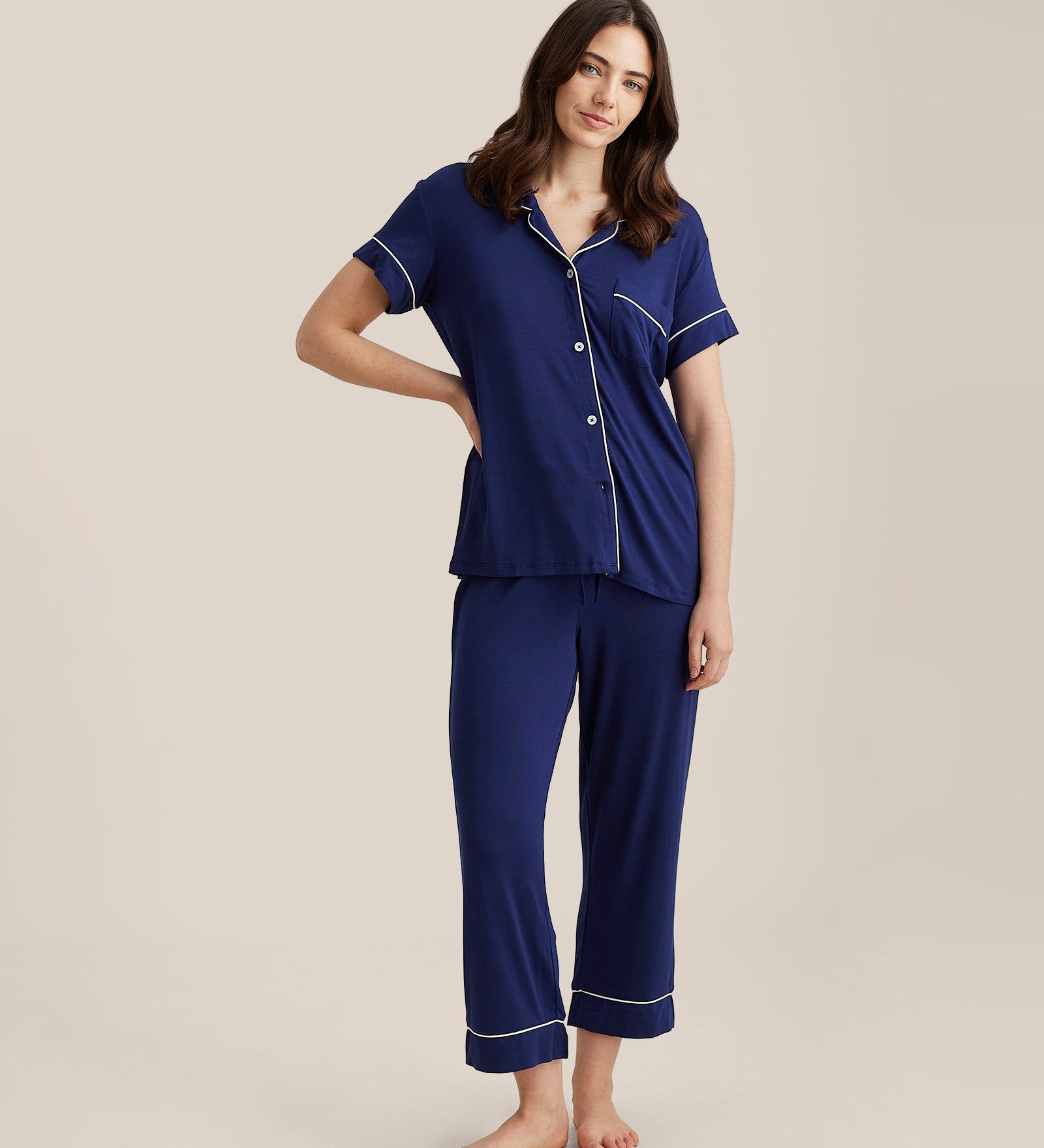 Front view of Papinelle Kate Modal Crop PJ Set in navy, showing button-up top with piping and cropped pants with drawstring waist.