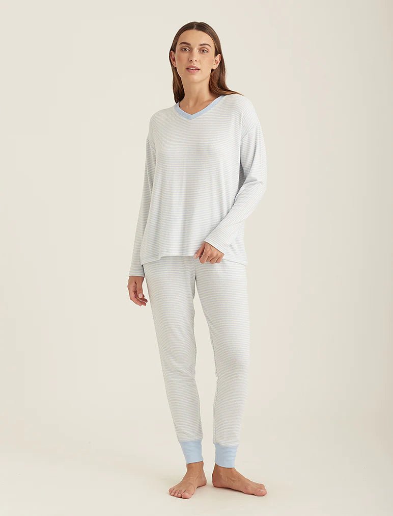 Model wearing Papinelle Feather Soft V-Neck LS Top and Jogger Set in Crystal Blue/Cream with a relaxed winter-ready fit.