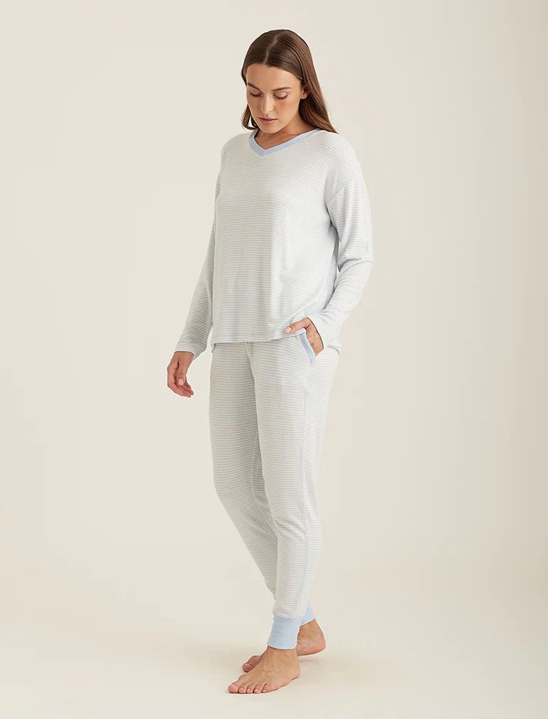 Side profile of the Feather Soft lounge set, highlighting the jogger cut and v-neckline on model.