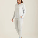 Side profile of the Feather Soft lounge set, highlighting the jogger cut and v-neckline on model.