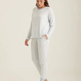 Side profile of the Feather Soft lounge set, highlighting the jogger cut and v-neckline on model.