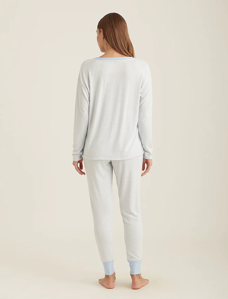 Back view of Papinelle PJ set showcasing the long sleeve top and jogger pant fit in soft blue cream tones.