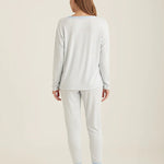 Back view of Papinelle PJ set showcasing the long sleeve top and jogger pant fit in soft blue cream tones.