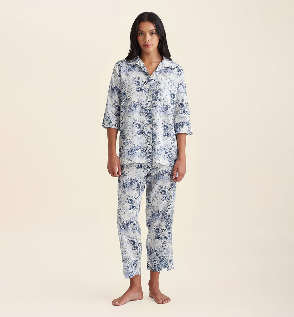 Front view of Papinelle Toile De Jouy Crop PJ Set in cotton print, featuring button-up shirt and cropped pants with drawstring waist.