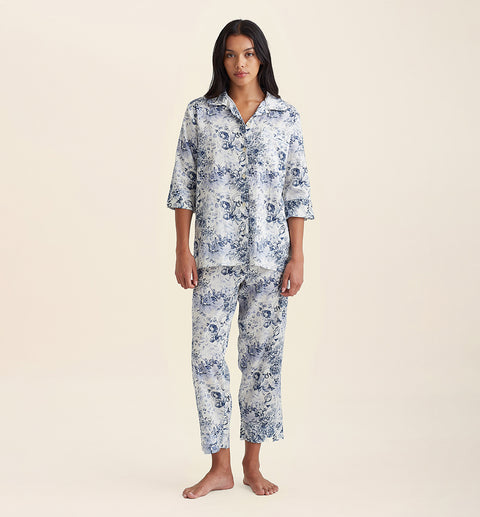 Front view of Papinelle Toile De Jouy Crop PJ Set in cotton print, featuring button-up shirt and cropped pants with drawstring waist.