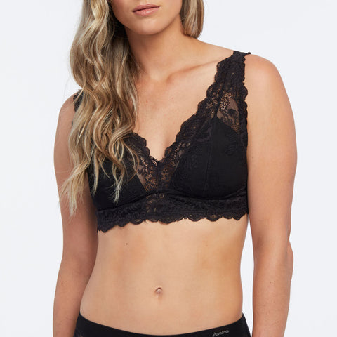 Close-up of black lace bralette with padded cups and floral detailing.