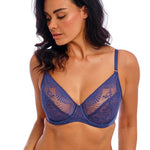 Side angle of model in Wacoal Sensu Lace Underwire Bra and briefs set in Dark Azure highlighting lace details and comfortable fit.