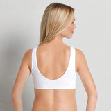 Back and side view of Anita Seamless Maternity Sleep Bra White on model, featuring broad straps and smooth coverage, provided by The Foundation.