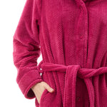 Givoni Dimple Fleece Mid Button Gown in Magenta, featuring a soft tie belt, button front, and ultra-light dimple fleece – available at The Foundation.