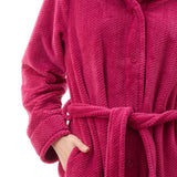 Givoni Dimple Fleece Mid Button Gown in Magenta, featuring a soft tie belt, button front, and ultra-light dimple fleece – available at The Foundation.