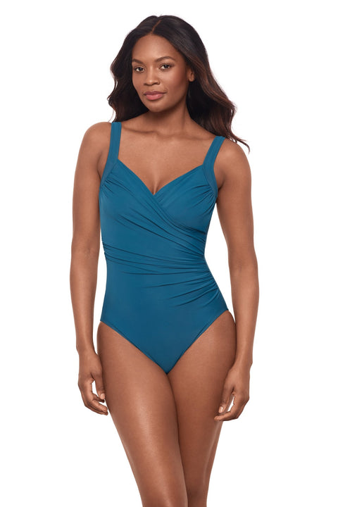 Woman in aegean blue cross over swimsuit