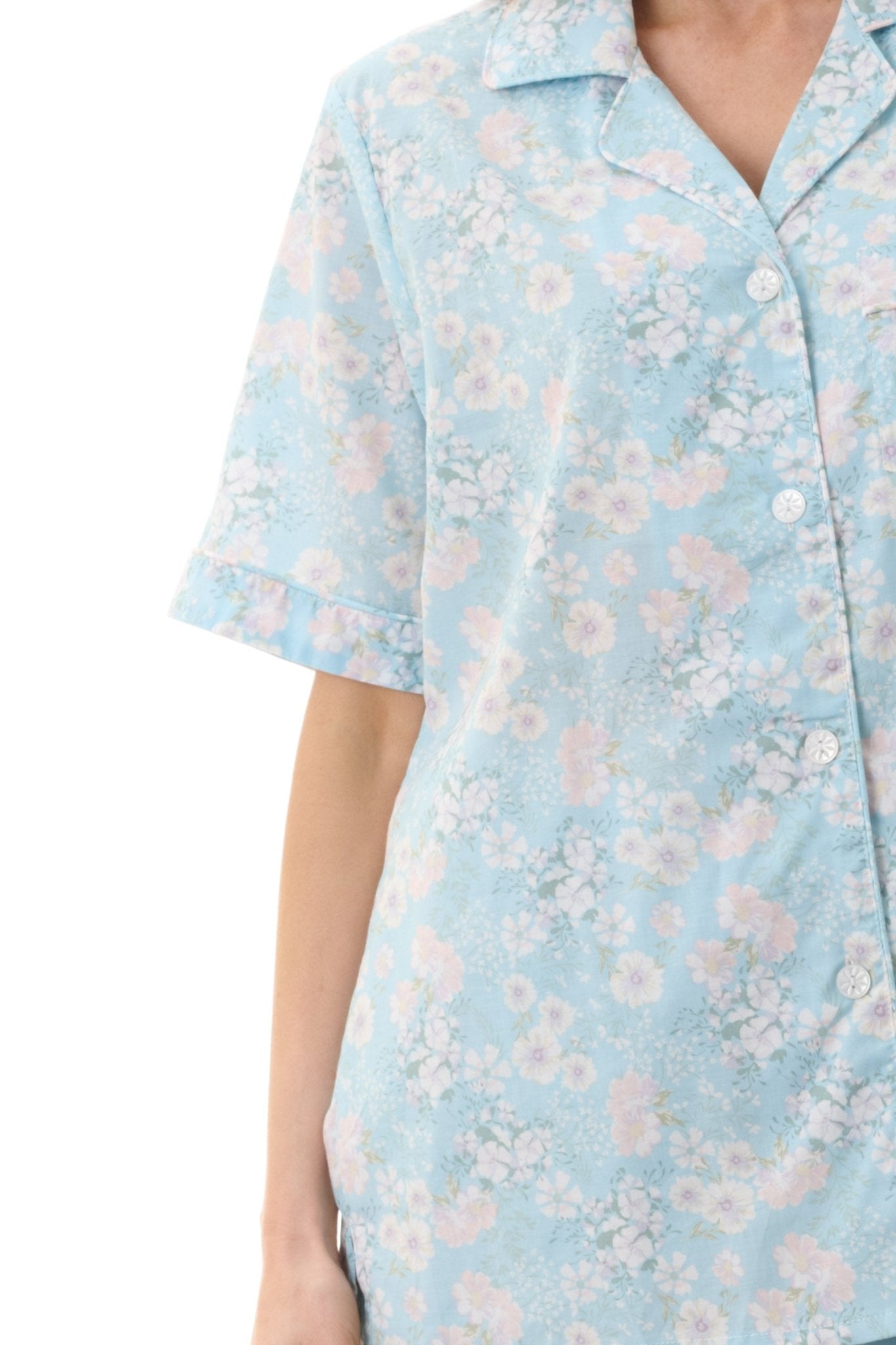 Close-up of Givoni Cora Capri Pyjama in cotton, featuring self-fabric piping, button front, and soft elastic drawstring waist.