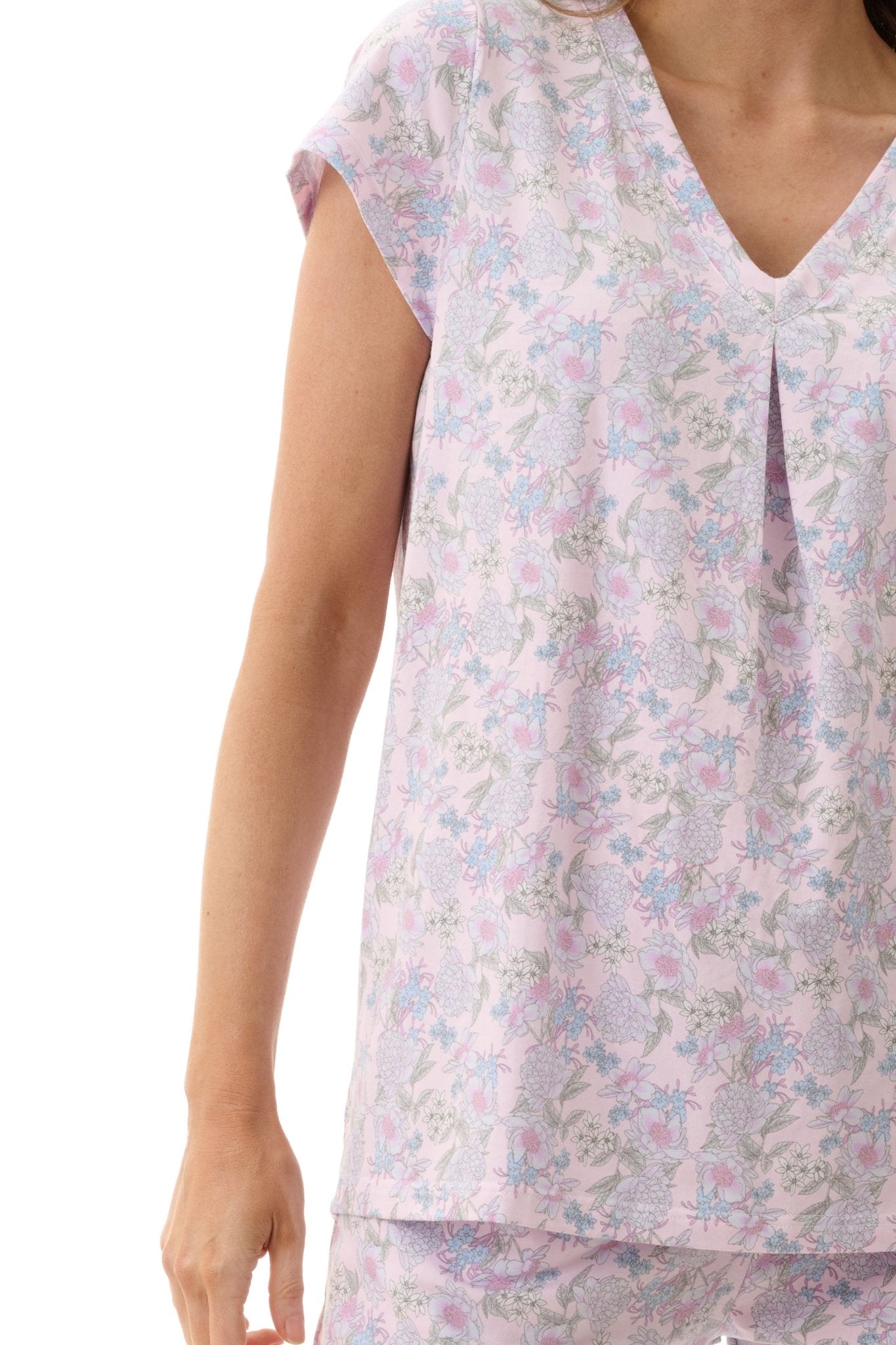 Close-up of Givoni Hope Capri Pyjama in pink floral bamboo blend, showing floral print, V-neckline, and side pocket detail.