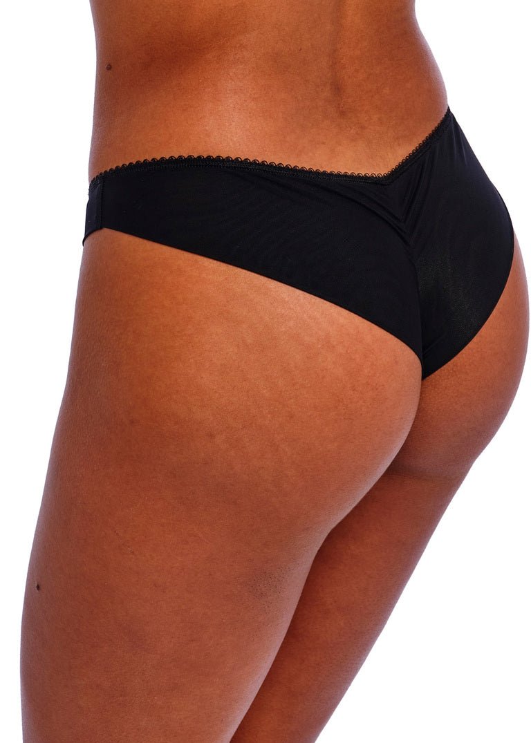 Side view close-up of Freya Loveland Brazilian Brief in black, showcasing lace and seamless finish.