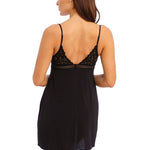 back view of Wacoal Raffine Chemise Black on model showing adjustable straps and elegant lace trim.