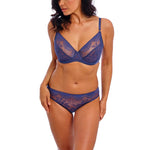 Model wearing Wacoal Sensu Lace Brief and Underwire Bra in Dark Azure showing mid-rise fit and scallop lace detail.