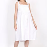 Model in white strappy cotton nightie with pintuck detail and broderie lace neckline, front view.