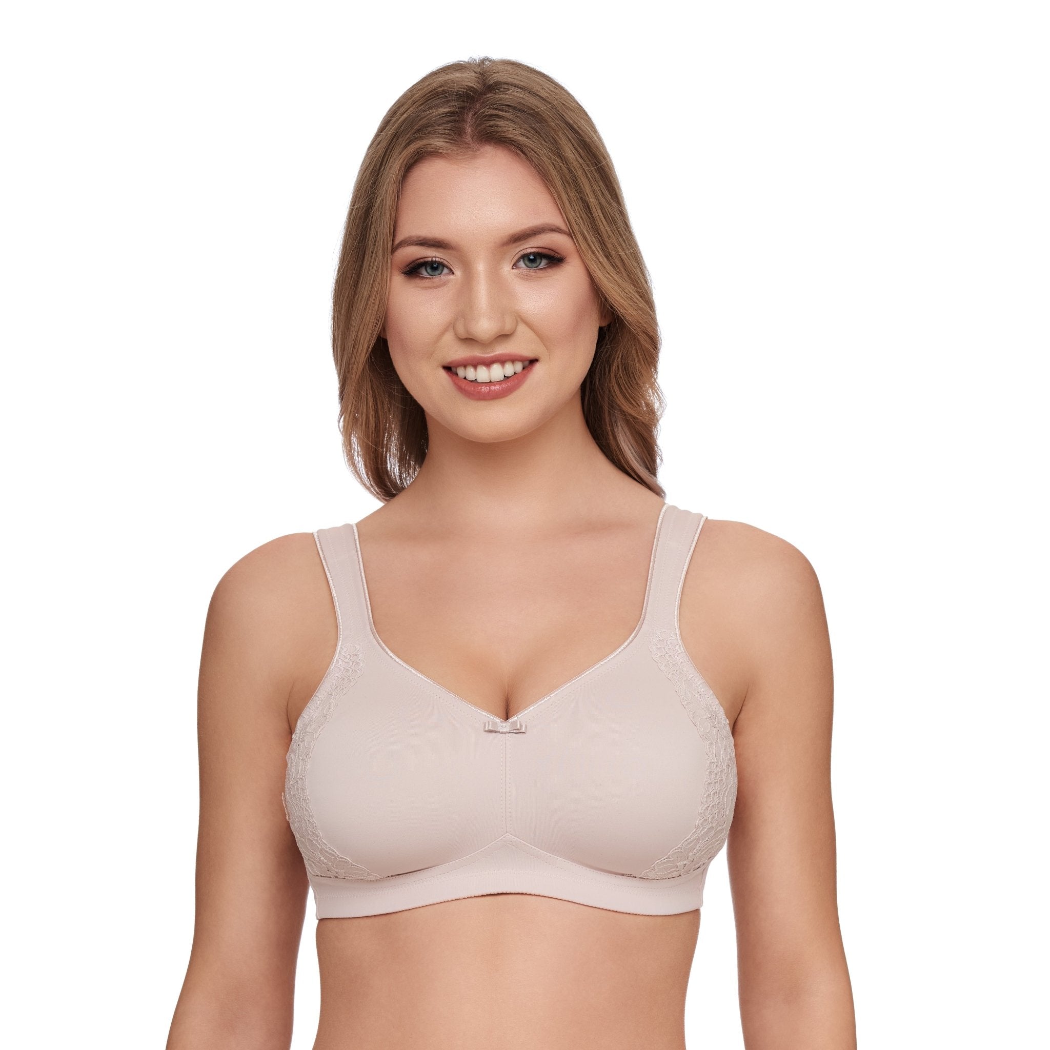 Model wearing Susa London Minimiser Bra in Sand, showing smooth shaping fit and wide, wirefree comfort straps.