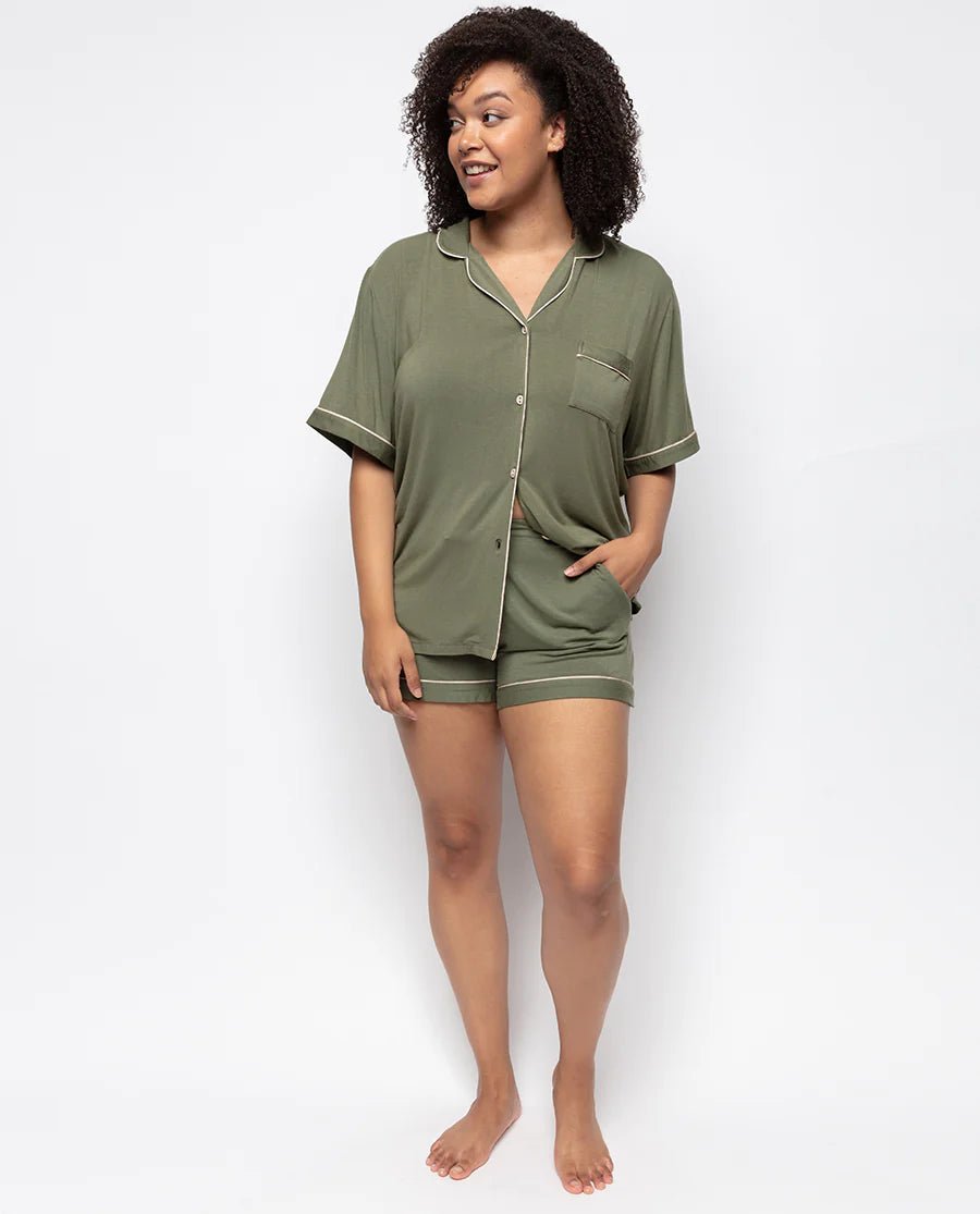 Model wearing the olive Cyberjammies jersey shorty set outdoors, showcasing revere collar and relaxed fit.