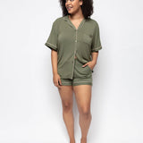 Model wearing the olive Cyberjammies jersey shorty set outdoors, showcasing revere collar and relaxed fit.