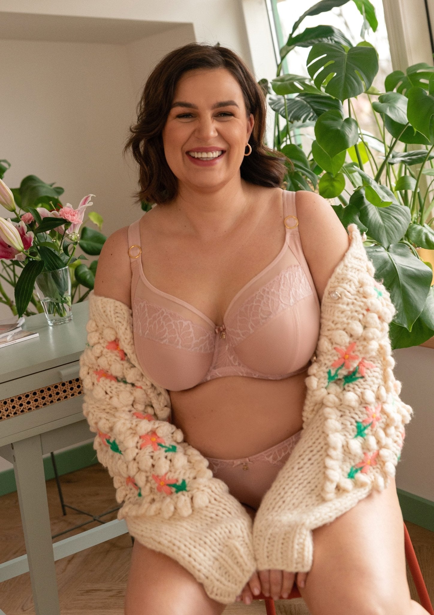 Samanta Amelia Full Cup Side Support Bra Rose, plus-size model seated, full bust bra with delicate German lace, luxury lingerie at The Foundation.