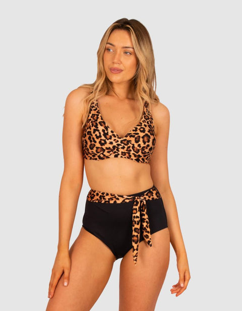 Model wearing full set of the Zambia D/E Wrap Bra and High Pant in mocha animal print, available now at The Foundation.