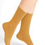 Bleuforêt Wool Cashmere Socks in Jaune Doré Golden Yellow worn mid-calf, featuring soft breathable knit for warmth and style, from The Foundation.