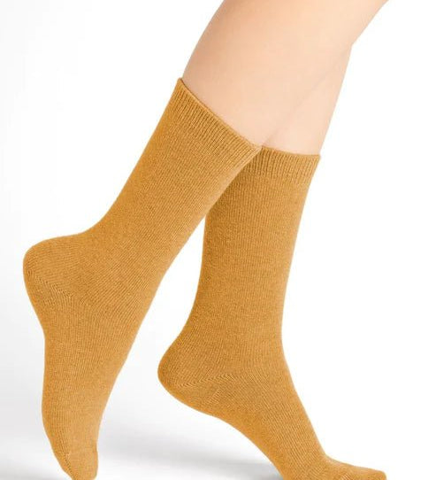 Bleuforêt Wool Cashmere Socks in Jaune Doré Golden Yellow worn mid-calf, featuring soft breathable knit for warmth and style, from The Foundation.
