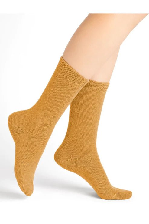Bleuforêt Wool Cashmere Socks in Jaune Doré Golden Yellow worn mid-calf, featuring soft breathable knit for warmth and style, from The Foundation.