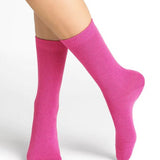 Bleuforêt Wool Cashmere Socks in vibrant Rosa pink worn mid-calf, showcasing soft cosy knit and French-made luxury, available at The Foundation.
