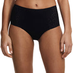 Model wearing the Norah High Waist Covering Brief Black, showcasing the fit and floral design, available at The Foundation.
