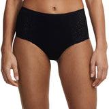 Model wearing the Norah High Waist Covering Brief Black, showcasing the fit and floral design, available at The Foundation.