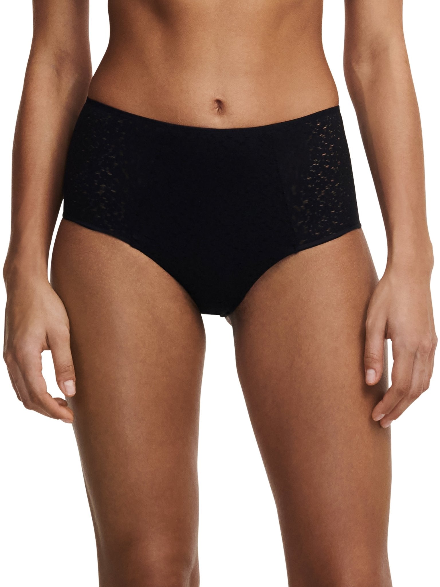Model wearing the Norah High Waist Covering Brief Black, showcasing the fit and floral design, available at The Foundation.