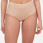Front view of model wearing Norah High Waist Brief by Chantelle in Golden Beige, featuring full coverage and sheer tulle sides, from The Foundation.