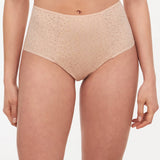 Front view of model wearing Norah High Waist Brief by Chantelle in Golden Beige, featuring full coverage and sheer tulle sides, from The Foundation.