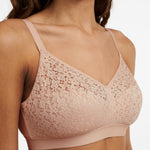 Side view of The Foundation’s Norah Wirefree Support Bra in Golden Beige with delicate floral lace and soft moulded finish.