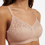 Side view of The Foundation’s Norah Wirefree Support Bra in Golden Beige with delicate floral lace and soft moulded finish.