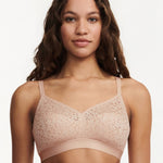 Model wearing the Norah Wirefree Bra in Golden Beige by The Foundation—wire-free comfort with floral stretch lace.
