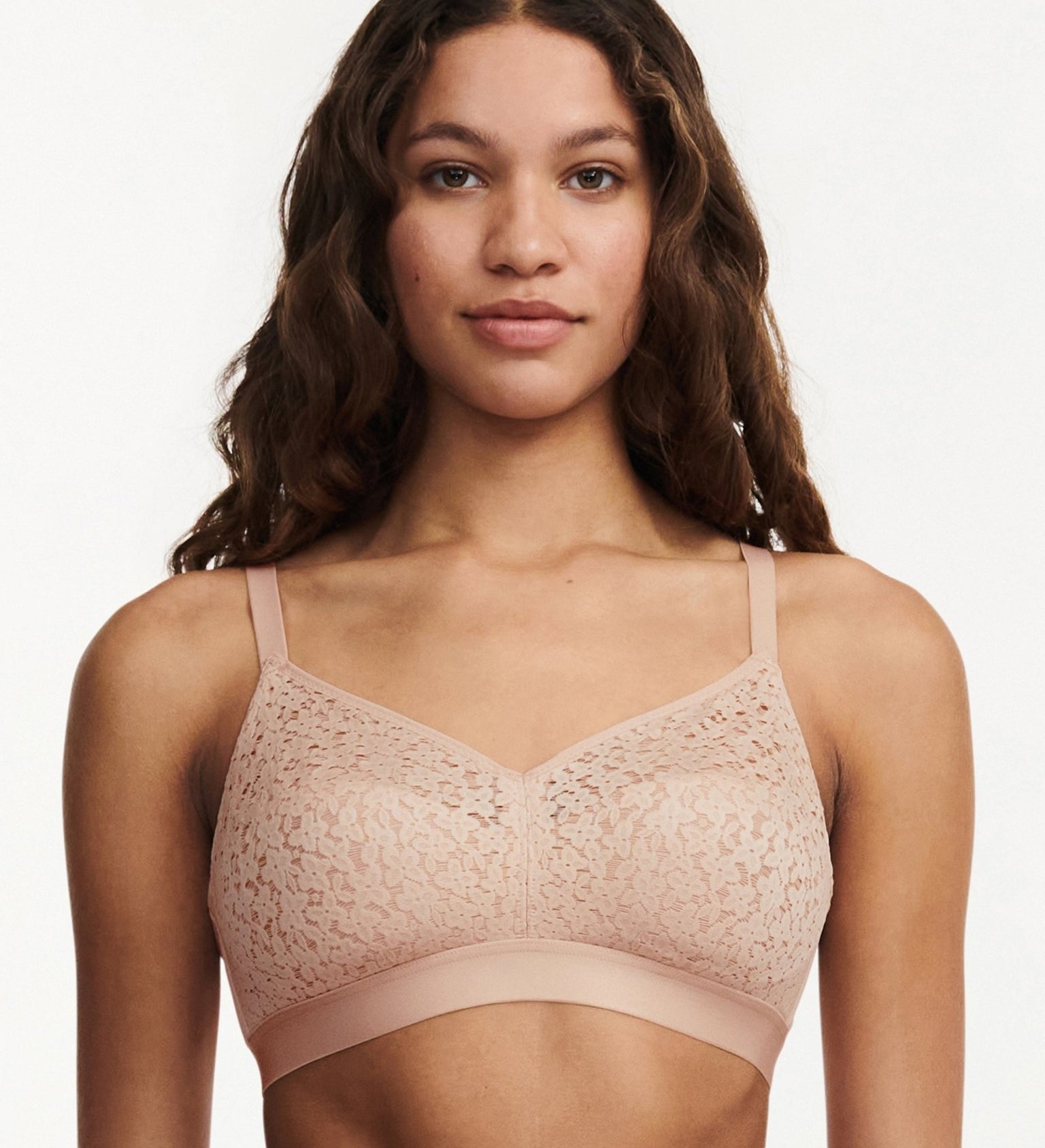 Model wearing the Norah Wirefree Bra in Golden Beige by The Foundation—wire-free comfort with floral stretch lace.