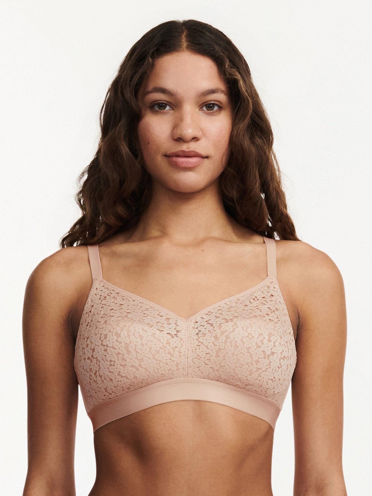 Model wearing the Norah Wirefree Bra in Golden Beige by The Foundation—wire-free comfort with floral stretch lace.