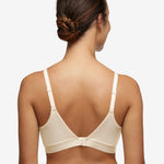 Back view of Chantelle Norah Wirefree Support Bra Pearl on model, showing smooth band and adjustable straps, from The Foundation.