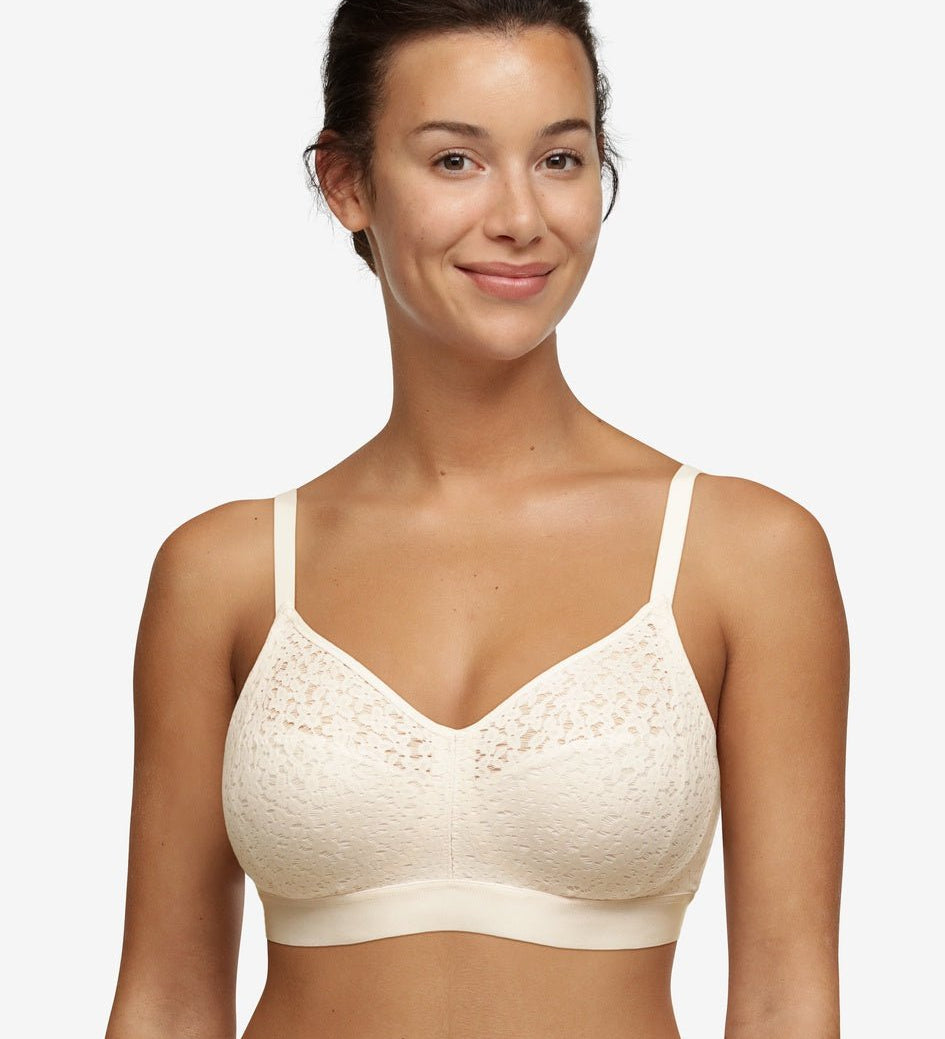 Model wearing Chantelle Norah Wirefree Support Bra Pearl, front view highlighting floral lace and seamless fit, available at The Foundation.