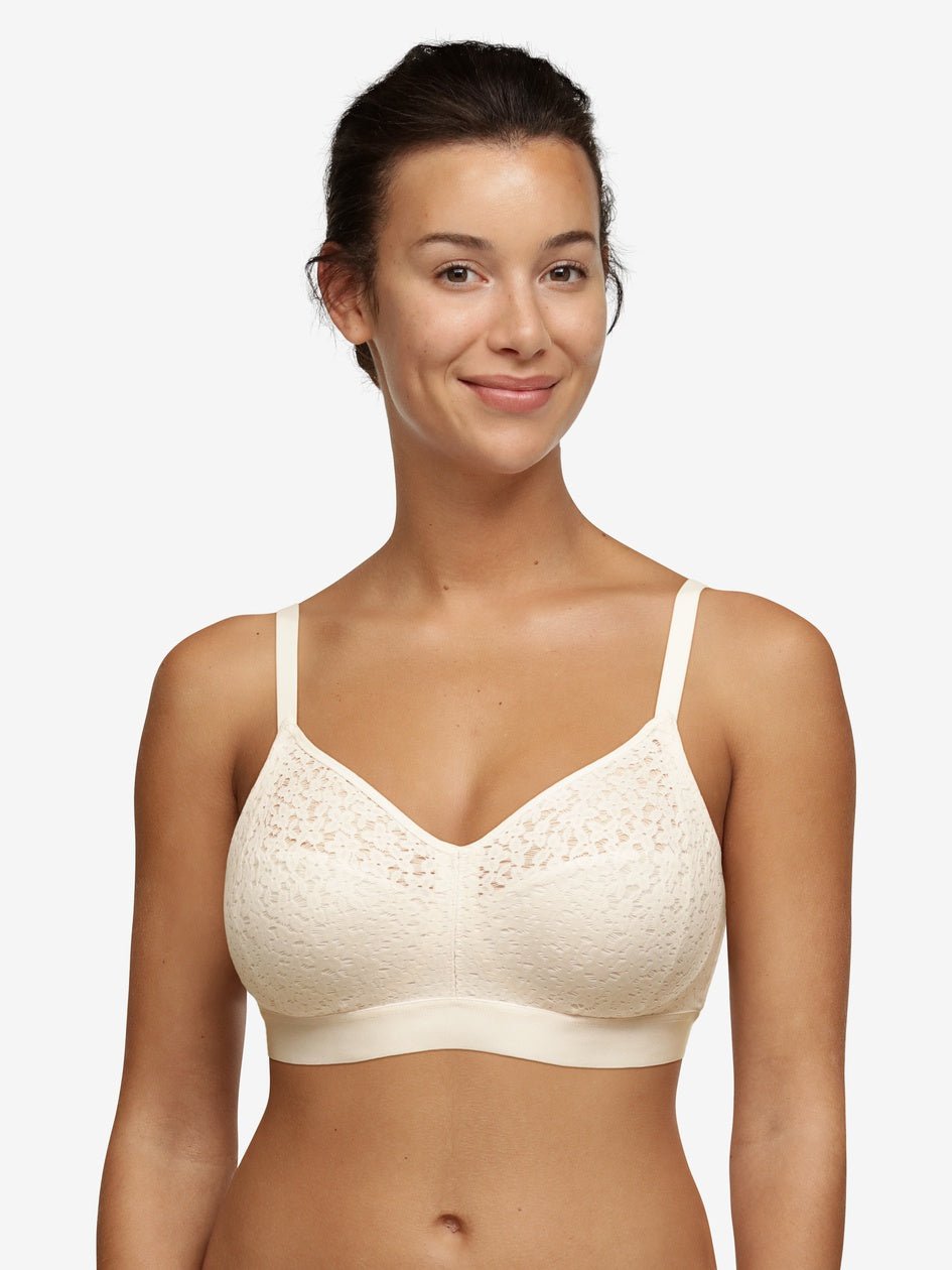 Model wearing Chantelle Norah Wirefree Support Bra Pearl, front view highlighting floral lace and seamless fit, available at The Foundation.