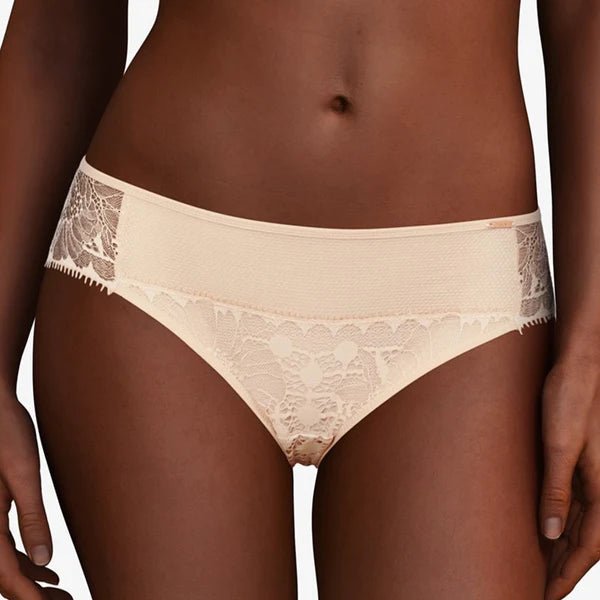 Chantelle Day to Night Brief in Golden Beige, front view showing mesh-lined lace panel and classic mid-rise bikini cut.